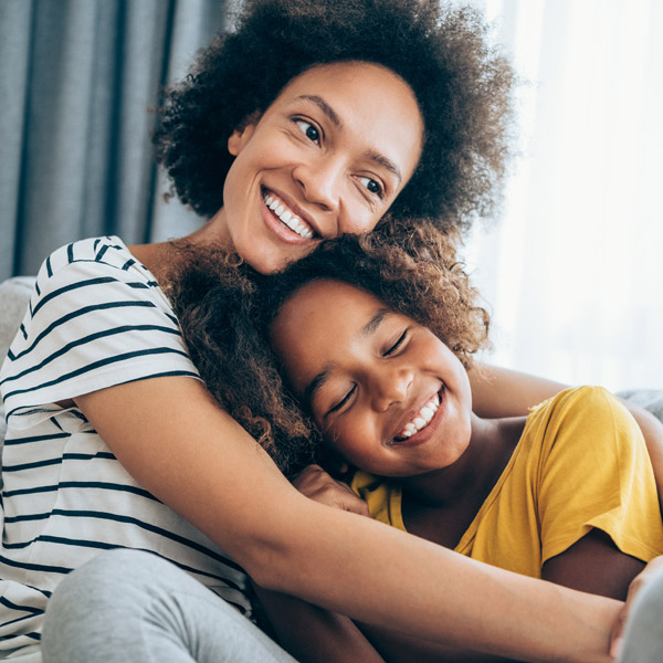 mother hugging her daughter